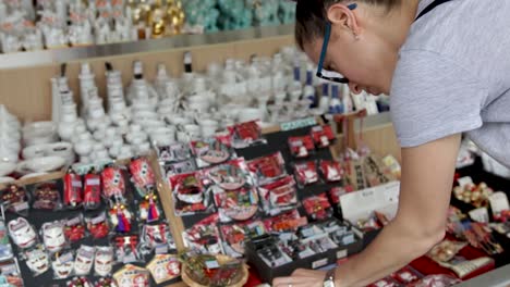 European-tourist-girl-looking-at-Japanese-souvenirs