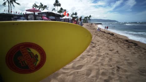 Detail-of-Lifeguard-surfboard-in-negative-space-framing-in-a-Oahu-Beach,-in-Hawaii---Static-medium-close-up-shot