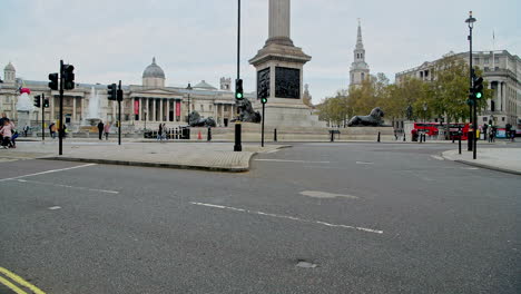 Quiet,-empty-streets-in-London-with-no-cars-or-traffic-during-Coronavirus-Covid-19-pandemic-lockdown-at-Trafalgar-Square-and-Nelsons-Column-in-London-in-the-City-of-Westminster,-England,-UK