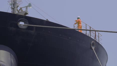 Sailor-Standing-And-Giving-Directions-On-The-Deck-Of-A-Mooring-Vessel-At-The-Port