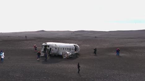 Slow-aerial-orbiting-shot-of-the-debris-of-the-Slheimasandur-DC3-plane-in-Iceland