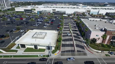 Aerial-Drone-flying-across-Del-Amo-Fashion-Center-parking-lot-and-businesses