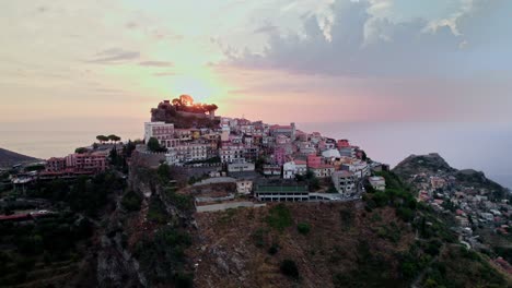 Flying-over-Castelmola-small-town-with-a-drone-which-is-located-near-Taormina-during-sunrise
