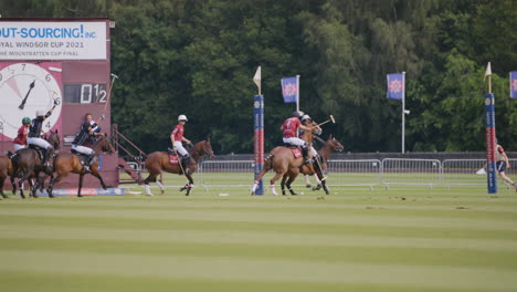 Polo-player-on-horseback-scores-a-point-whilst-defenders-try-and-stop-them
