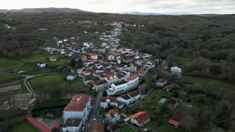 Aerial-pullback-reveals-Molgas-village-in-countryside-of-Ourense-Spain