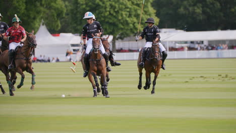 Polo-players-clash-against-each-other-whilst-on-horseback-trying-to-claim-the-ball