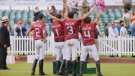 Thrilled-Polo-team-lift-trophy-in-celebration-of-victory