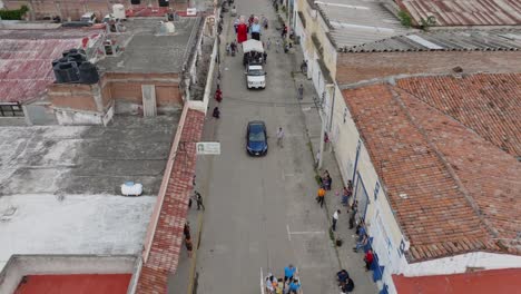 Aerial-birds-eye-shot-of-Mexican-street-with-people-celebrating-Mariachi-Festival-2023-in-Mexico