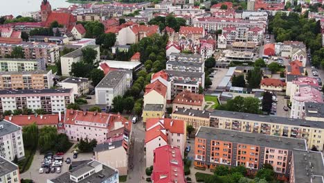 Colorful-apartment-buildings-and-downtown-of-Elk-city-in-Poland,-aerial-view