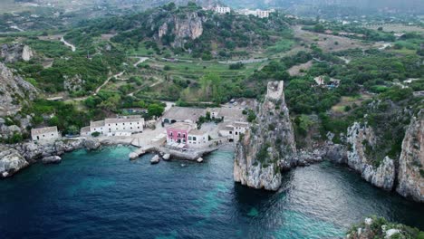 Aerial-drone-shot-about-Scopello's-scenic-village-at-the-beach