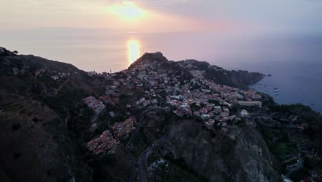 Aerials-shot-with-a-drone-over-Taormina-city-during-sunset