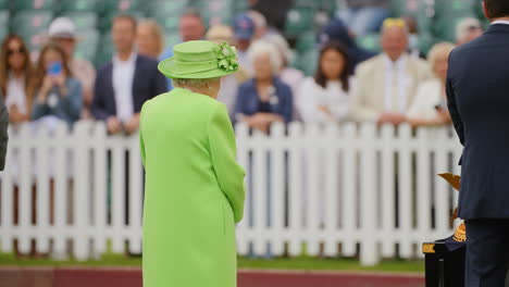 Queen-Elizabeth-II-talks-to-Polo-official-as-she-awaits-to-award-trophies