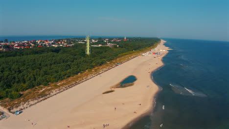 Aerial-view-of-drone-flying-above-the-beach-in-Jastarnia,-Poland-at-sunny-summer-day