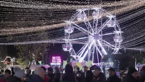 Glowing-Ferris-Wheel-With-A-Crowd-Of-People-In-The-City-Of-Galati-In-Romania-During-Holidays