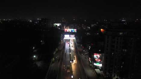 Rajkot-aerial-drone-view-Lots-of-vehicles-and-going-through-under-bridge