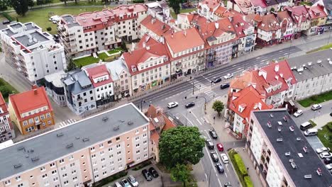 Street-traffic-and-city-buildings-of-Elk,-Poland,-aerial-view