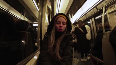 Wide-shot-of-female-passenger-on-Paris-metro-transportation