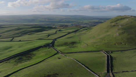 Establishing-Aerial-Shot-of-Fields-in-Yorkshire-Dales-and-Hilly-Landscape