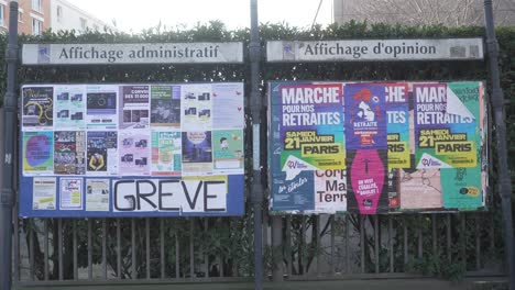 Wall-of-advertisements-and-flyers-in-the-streets-of-Paris,-France