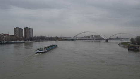 Novi-Sad,-Serbia---January-6,-2024:-River-cargo-ship-on-Danube-in-Novi-Sad