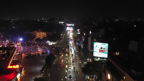 Rajkot-aerial-drone-view-is-going-towards-the-city,-vehicles-are-passing-by