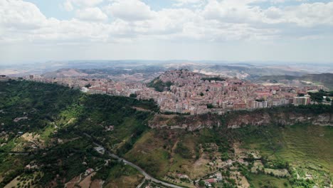 Flying-drone-over-Enna-city-old-town-in-Sicily-which-is-located-on-the-top-of-a-mountain