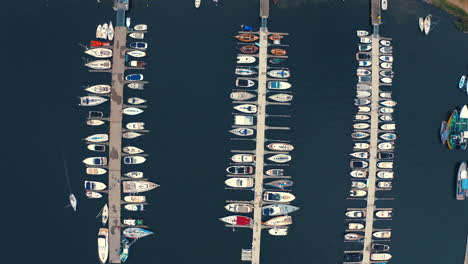 Bird-eye-view-of-drone-above-the-moored-yachts-in-the-marina-at-sunny-summer-day
