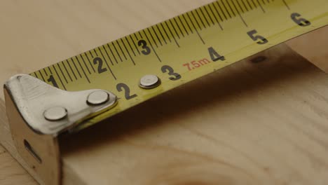 Close-up-of-Measuring-tape-used-to-measure-plank