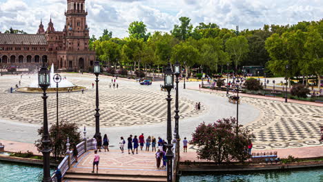 Busy-People-At-Historic-Plaza-de-Espana-On-Sunny-Day-In-Seville,-Spain
