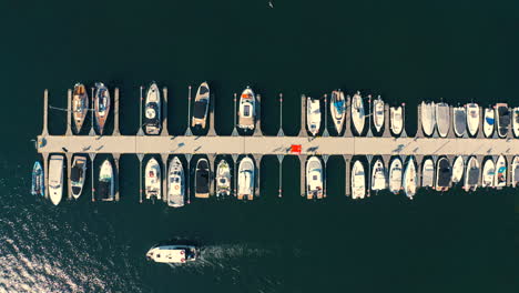 Aerial-view-of-flying-above-moored-yachts-in-the-marina