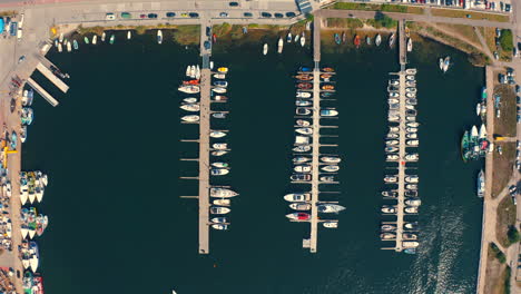 Top-down-drone-view-of-yachts-moored-in-the-marina-in-Jastarnia,-Poland