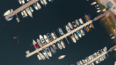 Bird-eye-view-of-luxurious-marina-with-moored-yachts-and-boats