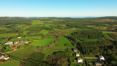 Castriz,-A-Coruña,-Galicia,-Spain---A-Scene-Featuring-Residences,-Farmland,-and-Lush-Vegetation---Aerial-Drone-Shot
