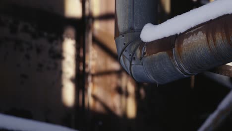 Snowy-pipe-in-an-abandoned-industrial-factory