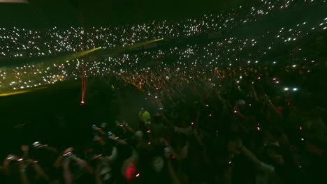 Fpv-drone-flight-over-hall-during-music-concert-with-fans-lighting-with-smartphone---ELADIO-CARRION-Concert-in-Santo-Domingo-at-night