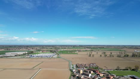 Drone-flies-over-an-expanse-of-freshly-cultivated-corn-fields-in-the-Po-Valley-in-Italy