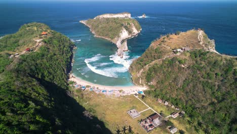 Atuh-Beach-Hidden-in-Limestone-Mount-Formations-in-Nusa-Penida,-Bali,-Indonesia---Aerial-High-Angle-Reveal