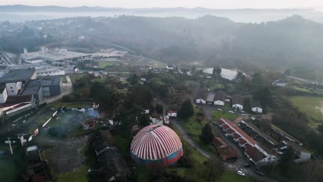 Drone-dolly-above-Benposta-circus-tent-in-Ourense-Spain-misty-morning