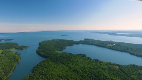 Beautiful-drone-shot-over-eastern-Canada-with-lush-greenery-and-many-lakes