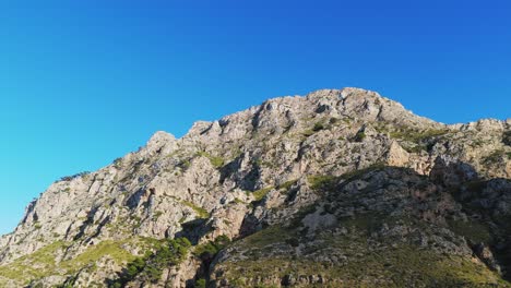 Panoramic-View-Of-Top-Edges-Of-Rocky-Mountains-On-A-Sunny-Day-In-Majorca,-Spain