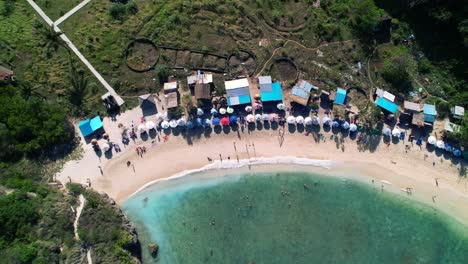 Atuh-Beach-shoreline-in-Nusa-Penida,-Bali-Indonesia---Aerial-Top-Down-Pan-View