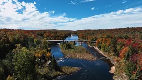 Road-Bridge-Across-River-During-Autumn-In-Upstate-New-York,-USA