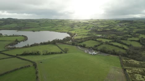 Typical-Green-Hued-Landscape-With-River-Over-County-Cavan,-Ireland-During-Sunrise