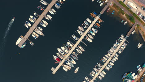 Drone-flying-above-yachts-moored-in-the-marina-in-Jastarnia,-Poland