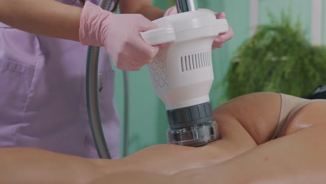 Beautician-At-Slimming-Session-With-Vacuum-Cavitation-Instrument-In-Beauty-Salon