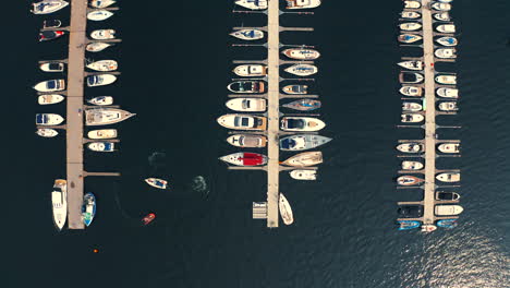 Drone-looking-down-to-the-yachts-moored-in-the-marina-in-Jastarnia,-Poland