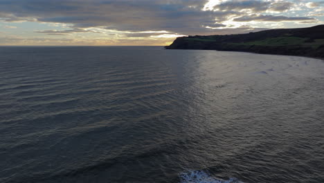 Establishing-Drone-Shot-over-Sea-of-North-Yorkshire-Cliffs-Coastline