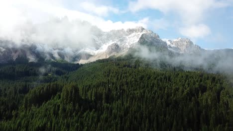 drone-footage-of-the-forest-at-Karersee,-South-Tyrol,-Italy
