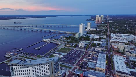 Aerial-view-of-buildings-and-residences-around-the-Fort-Myers-Bridge-over-the-ocean-in-Florida,-United-States