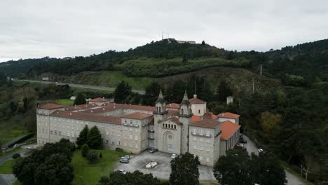 Drone-dolly-to-front-entrance-of-Catholic-seminary-religious-school-in-Ourense